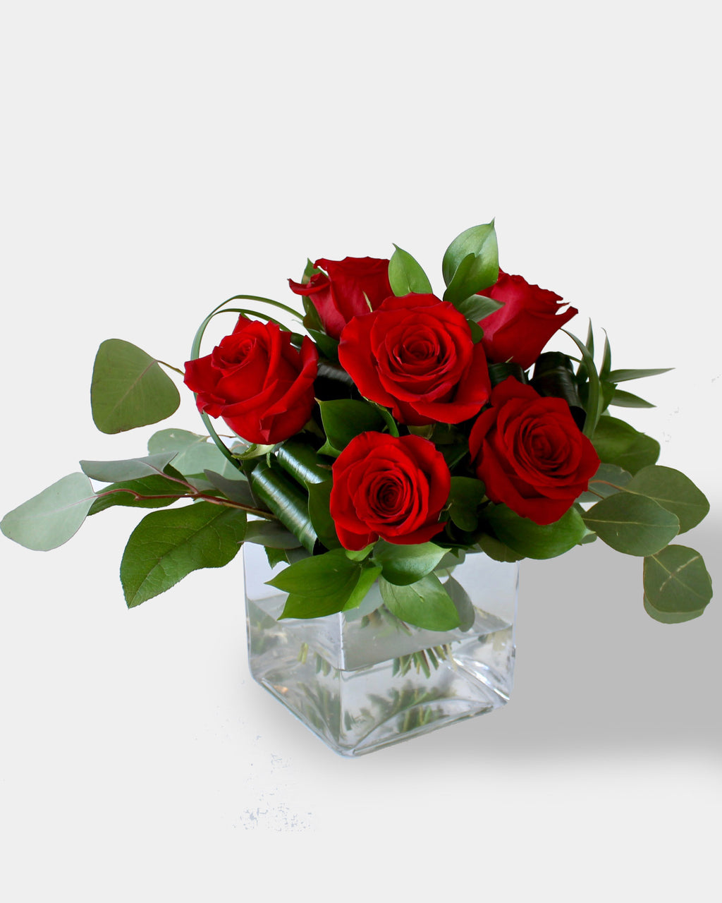 Six roses et cube de verre